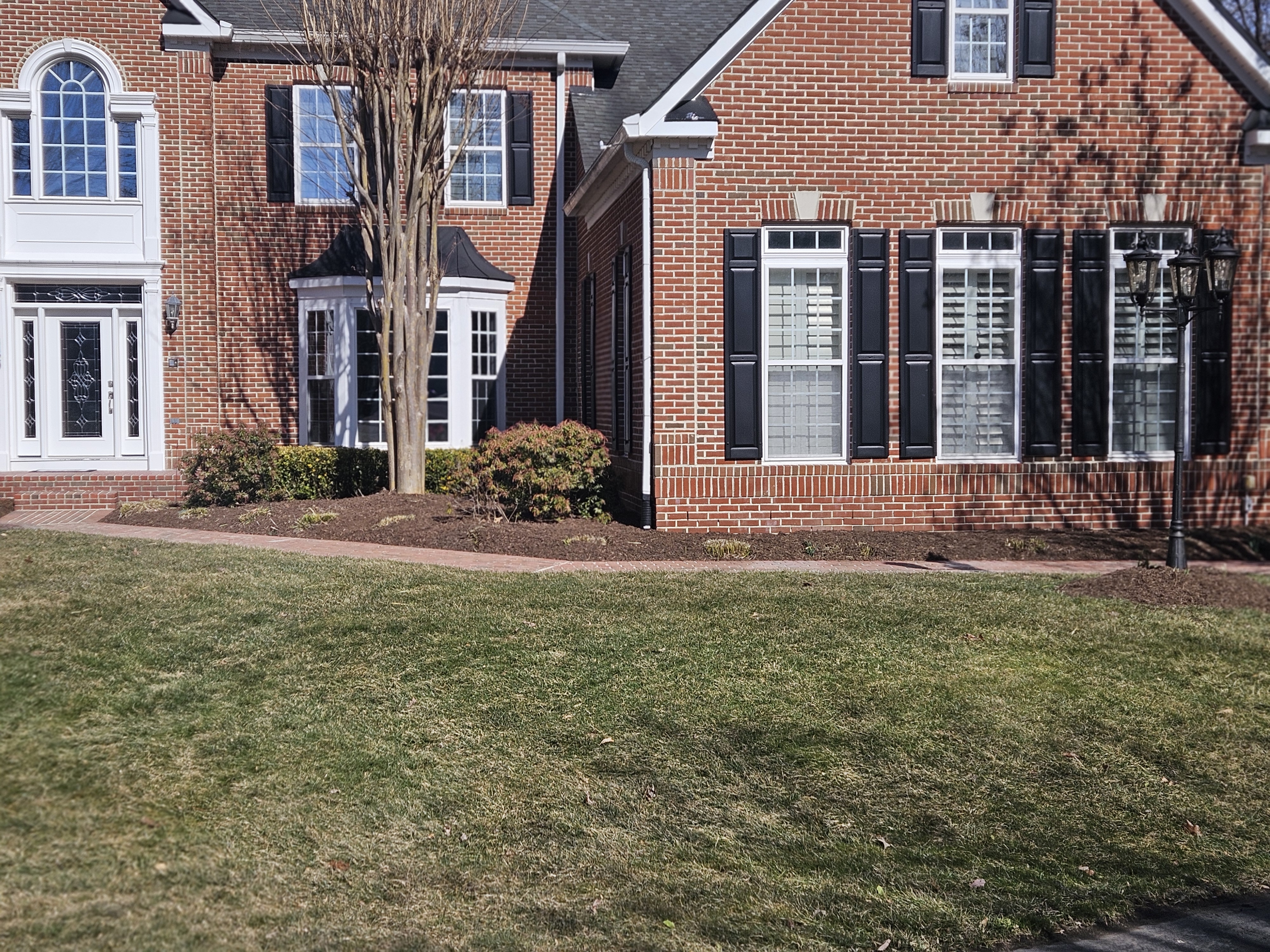 Professional landscaping with mulch and garden design